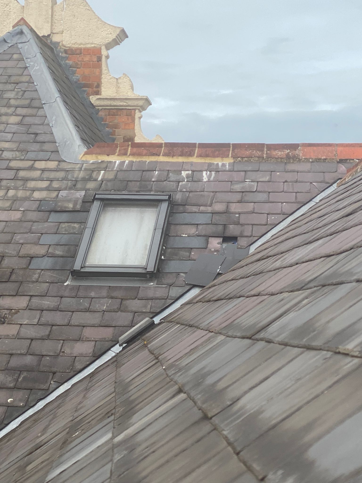 Broken roof tiles on a house